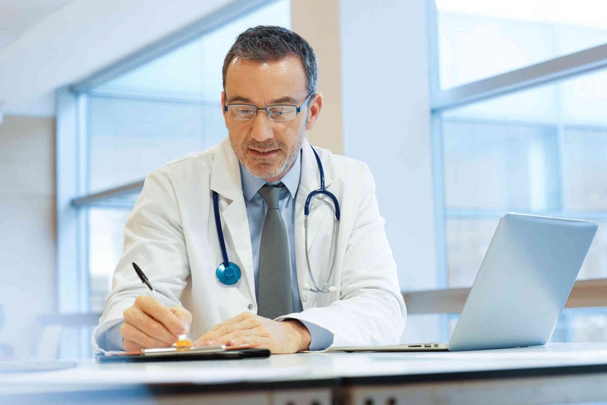 Doctor checking Critical Care Reviews journal watch