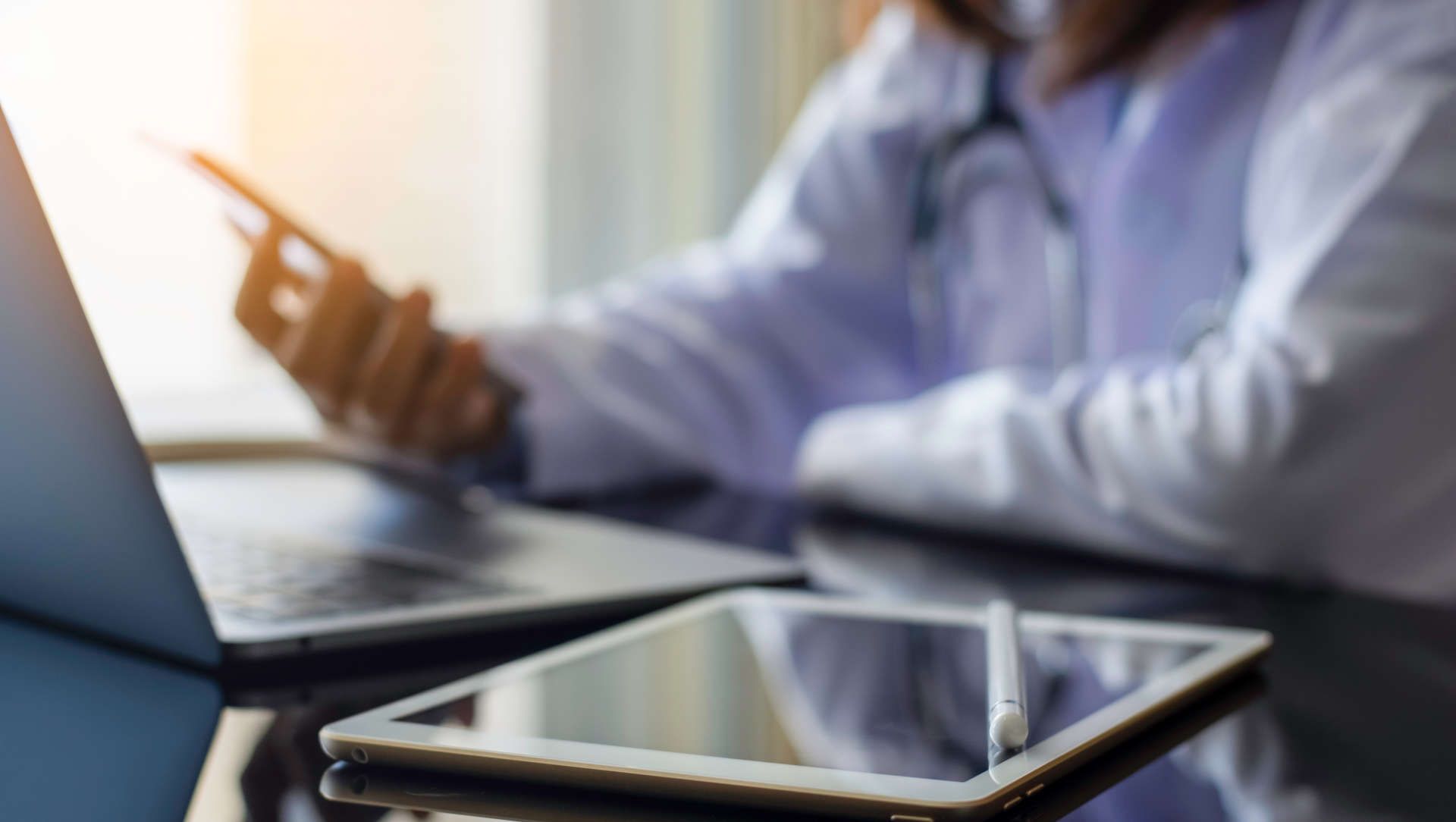 Doctor reading data from a mobile phone